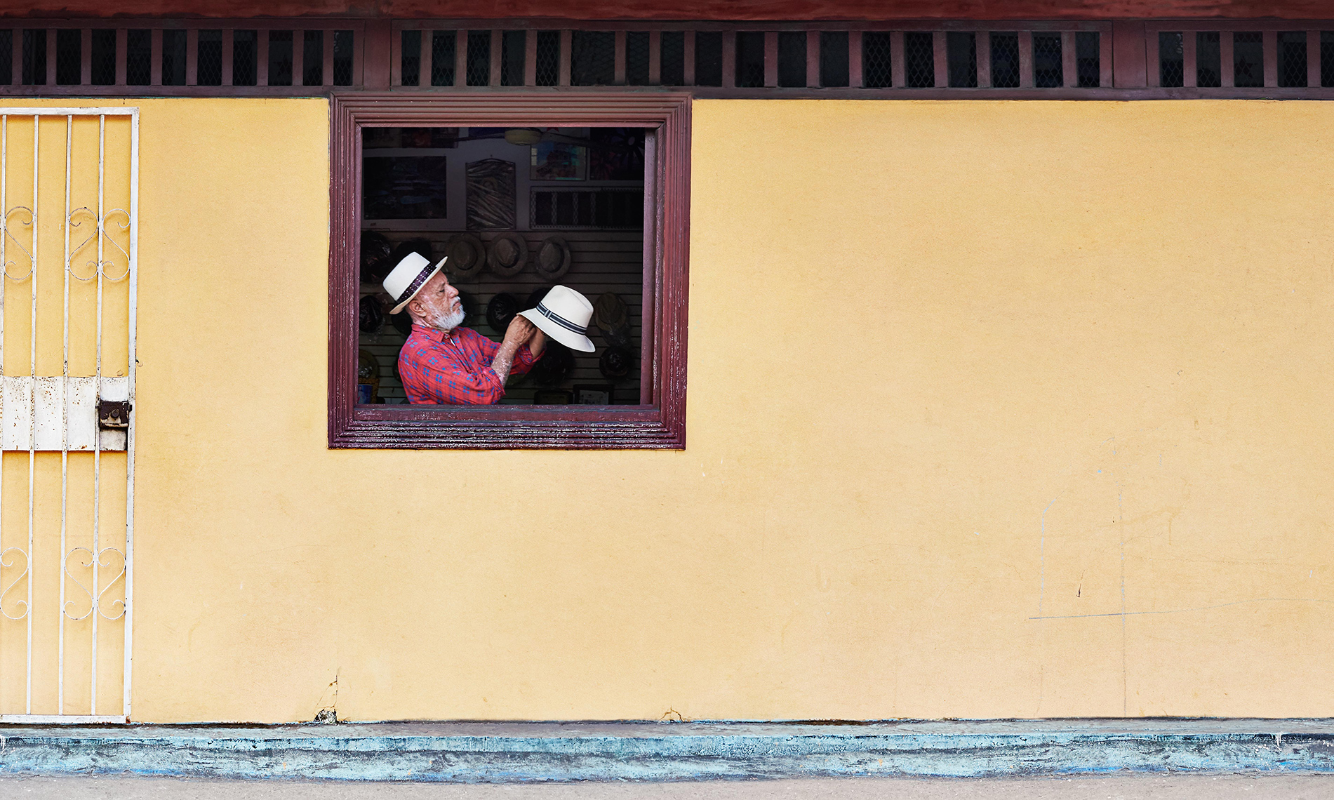 A Panama Hat maker inspects his latest creation in the El Chorrillo neighbourhood of Panama City