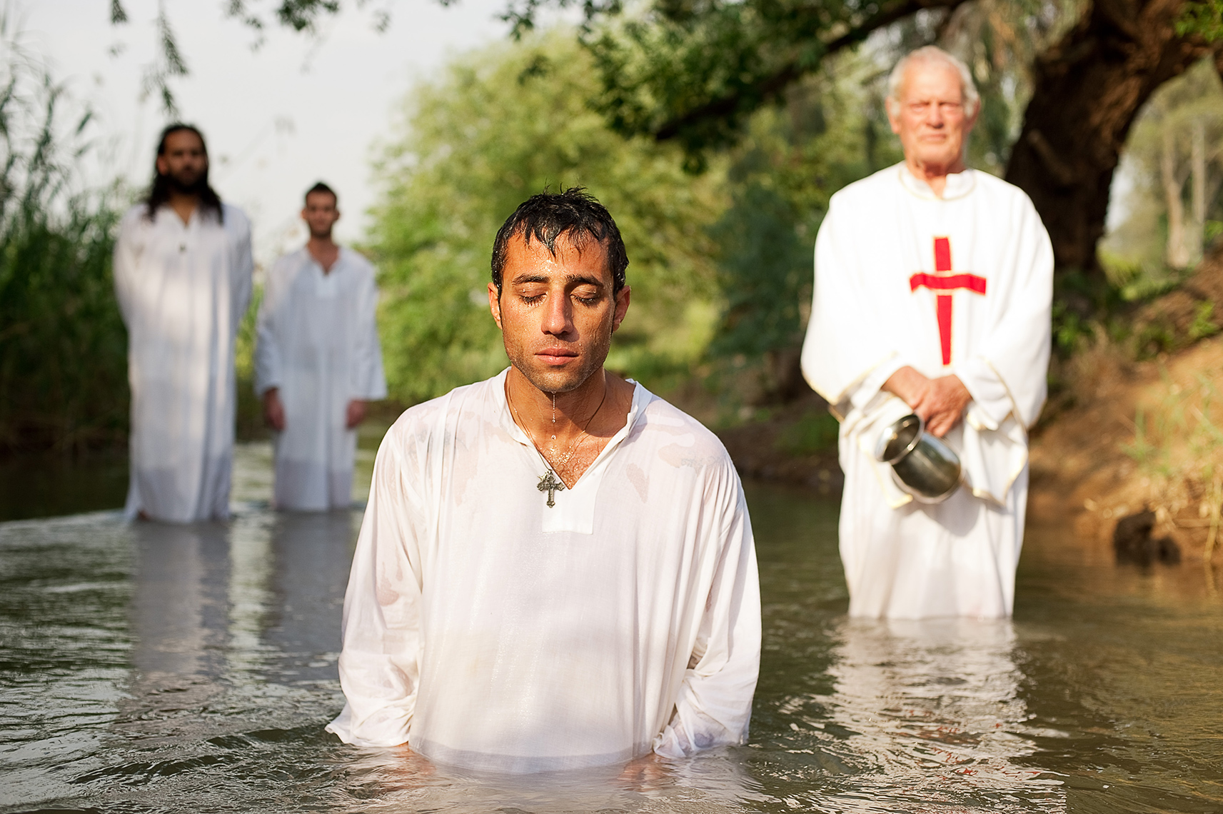 Baptism ceremony in a tributary of the River Jordan, Golan Heights, Israel