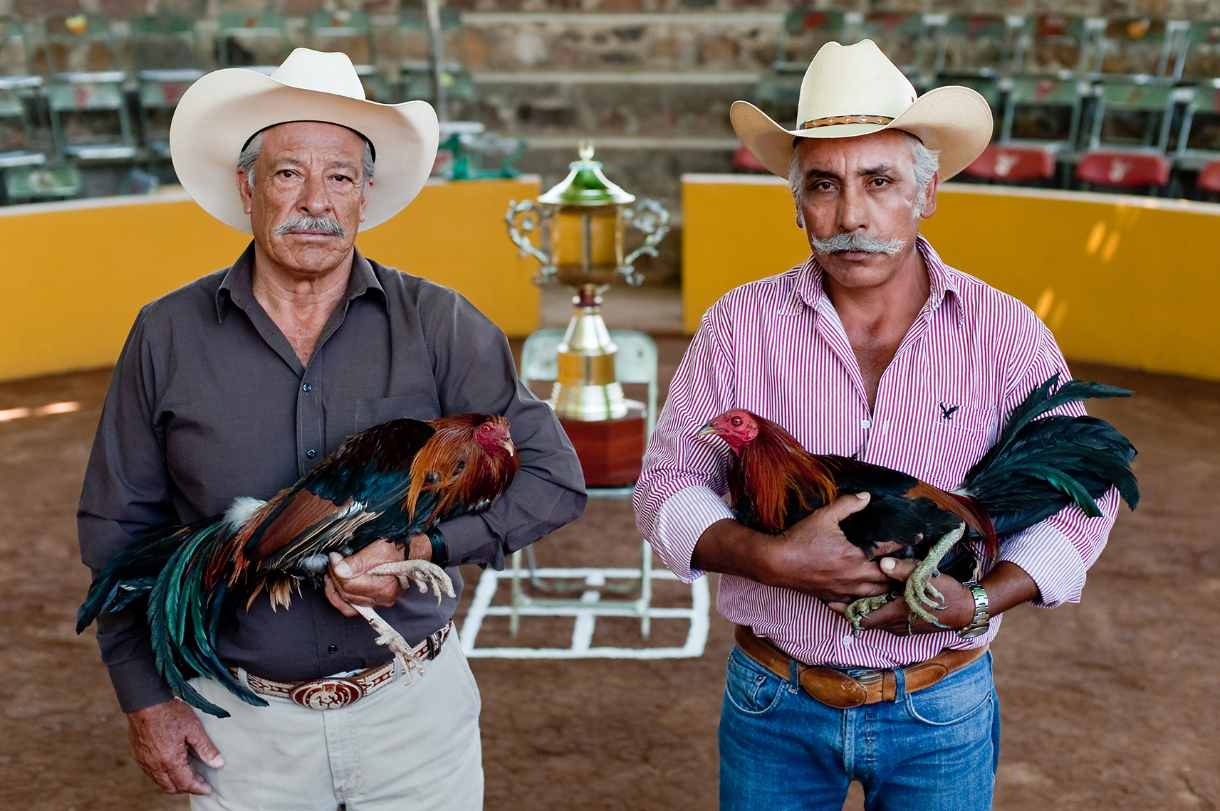 Contenders with their fighting birds before a trophy bout outside Mexico City, Mexico